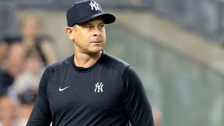 Aaron Boone #17 of the New York Yankees walks back to the dugout after being ejected in the top of the seventh inning during the game against the Atlanta Braves.
