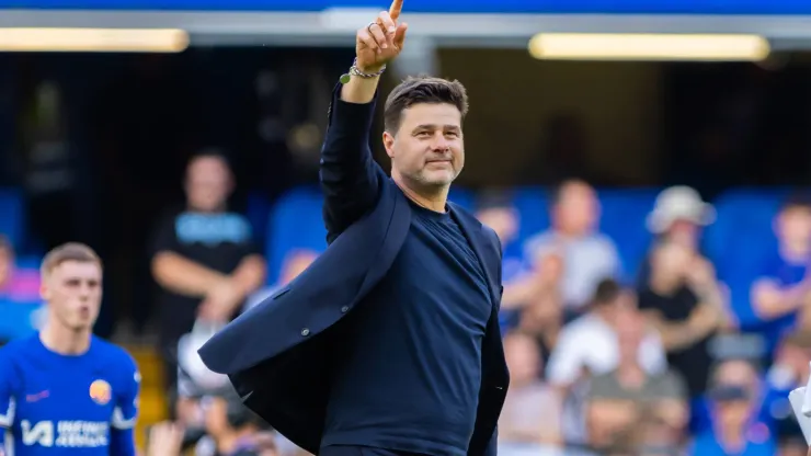 Mauricio Pochettino greets fans during a game
