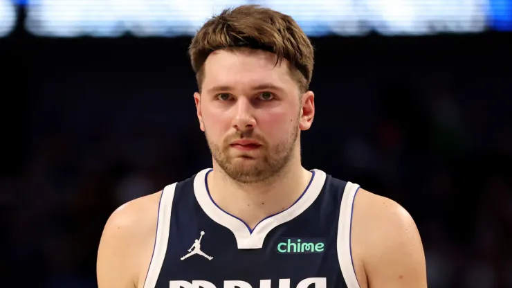 Luka Doncic #77 of the Dallas Mavericks walks down the court in the first half against the Los Angeles Lakers
