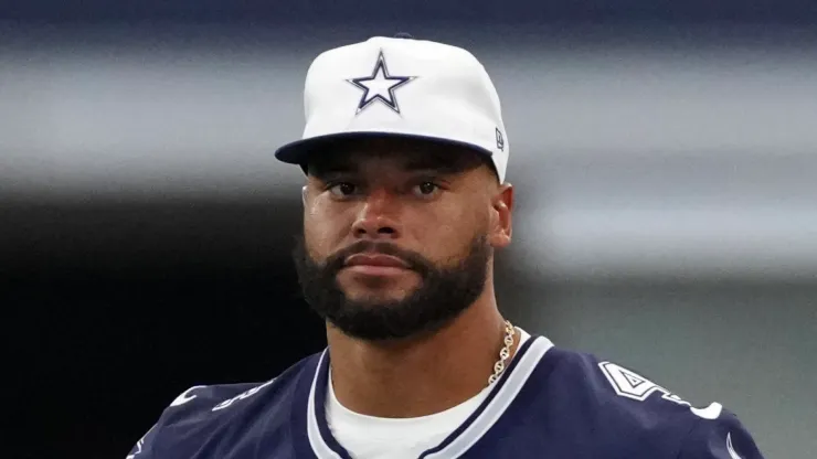 Dak Prescott #4 of the Dallas Cowboys looks on from the sideline during the first half of a preseason game against the Los Angeles Chargers at AT&T Stadium on August 24, 2024 in Arlington, Texas. 
