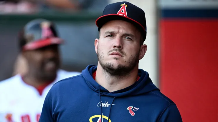 Mike Trout #27 of the Los Angeles Angels looks on from the dugout during the first inning against the Colorado Rockies at Angel Stadium of Anaheim.
