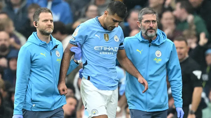 Rodri of Manchester City leaves the pitch following an injury during the Premier League match between Manchester City FC and Arsenal FC at Etihad Stadium on September 22, 2024 in Manchester, England.
