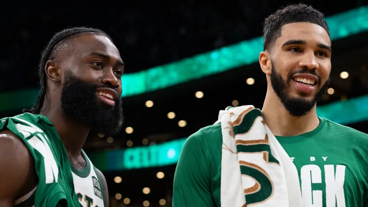 Jaylen Brown #7 of the Boston Celtics and Jayson Tatum #0 react after a win over the Philadelphia 76ers
