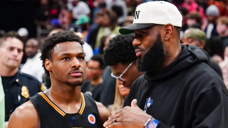 Bronny James #6 of the West team talks to Lebron James of the Los Angeles Lakers after the 2023 McDonald's High School Boys All-American Game at Toyota Center on March 28, 2023 in Houston, Texas.

