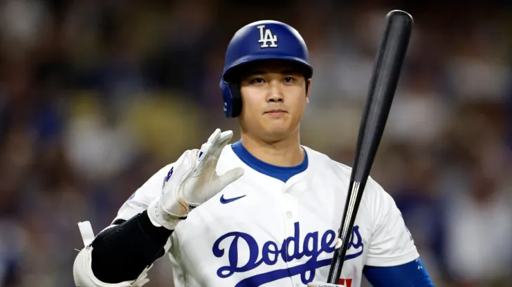 Shohei Ohtani #17 of the Los Angeles Dodgers salutes the San Diego Padres dugout as we walks up to bat during the first inning at Dodger Stadium on September 26, 2024 in Los Angeles, California. 
