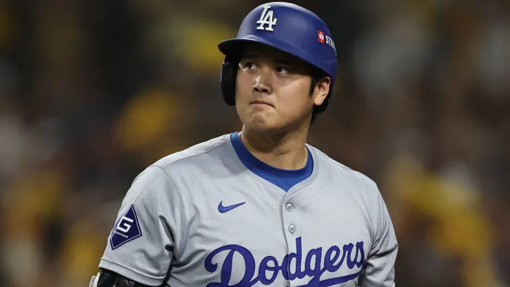 Shohei Ohtani #17 of the Los Angeles Dodgers walks back to the dugout after striking out in the eighth inning against the San Diego Padres during Game Three of the Division Series at Petco Park on October 08, 2024 in San Diego, California.
