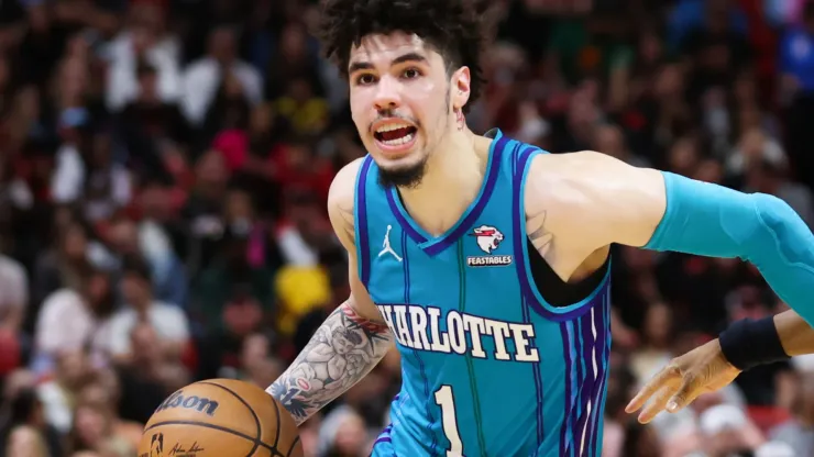  LaMelo Ball #1 of the Charlotte Hornets drives against Kyle Lowry #7 of the Miami Heat during the fourth quarter at Kaseya Center on January 14, 2024 in Miami, Florida.
