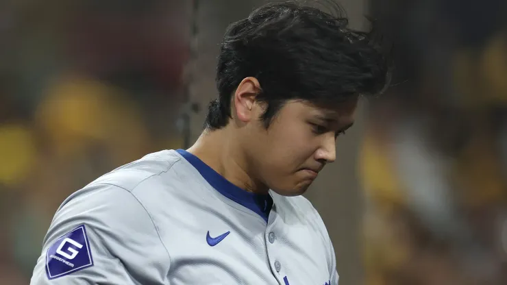 Shohei Ohtani #17 of the Los Angeles Dodgers walks back to the dugout after striking out in the eighth inning against the San Diego Padres during Game Three of the Division Series at Petco Park on October 08, 2024 in San Diego, California. 
