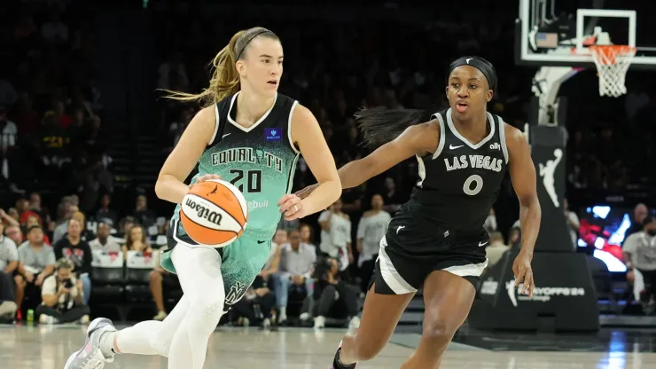 Sabrina Ionescu #20 of the New York Liberty drives against Jackie Young #0 of the Las Vegas Aces in the third quarter of Game Four of the 2024 WNBA Playoffs semifinals
