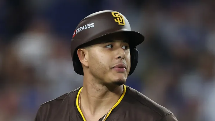 Manny Machado #13 of the San Diego Padres reacts after striking out against the Los Angeles Dodgers during the seventh inning of Game Five of the Division Series at Dodger Stadium on October 11, 2024 in Los Angeles, California. 
