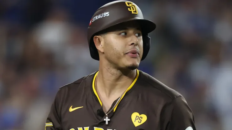 Manny Machado #13 of the San Diego Padres reacts after striking out against the Los Angeles Dodgers during the seventh inning of Game Five of the Division Series at Dodger Stadium on October 11, 2024 in Los Angeles, California. 
