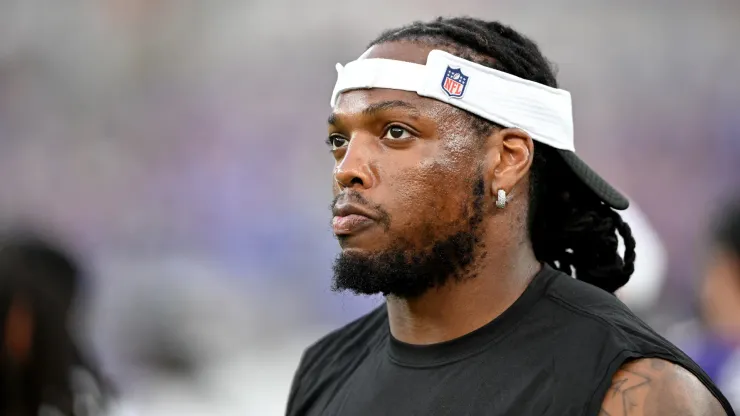 Derrick Henry #22 of the Baltimore Ravens watches the preseason game in the first quarter against the Philadelphia Eagles at M&T Bank Stadium on August 09, 2024 in Baltimore, Maryland.
