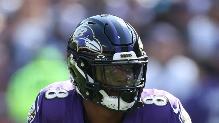 Quarterback Lamar Jackson #8 of the Baltimore Ravens rushes with the ball against the Washington Commanders at M&T Bank Stadium on October 13, 2024 in Baltimore, Maryland.
