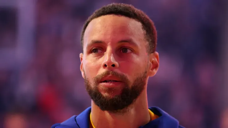 Stephen Curry #30 of the Golden State Warriors stands for the national anthem before their preseason game against the Sacramento Kings at Chase Center on October 11, 2024 in San Francisco, California. 
