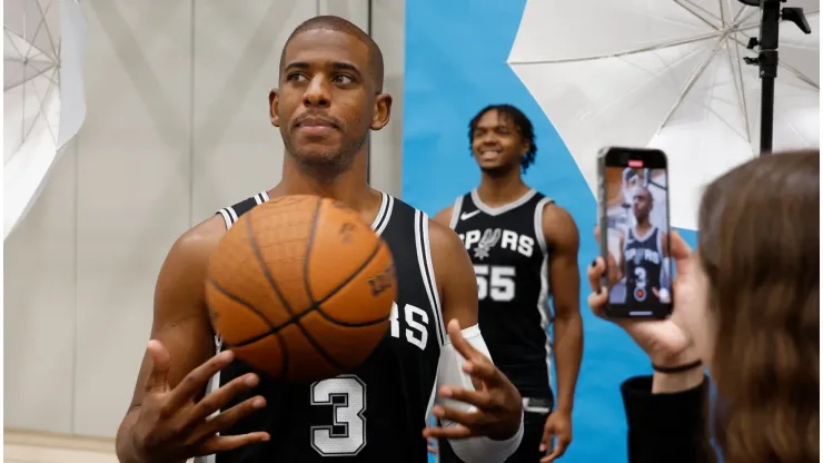 Chris Paul #3 of the San Antonio Spurs poses for a video as Harrison Ingram #55 is photographed at the San Antonio Spurs Media Day at the Victory Capital Performance Center on September 30, 2024 in San Antonio, Texas. 
