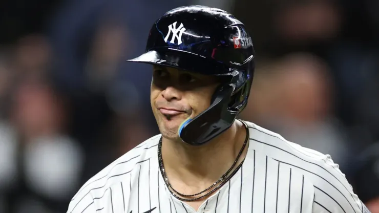 Giancarlo Stanton #27 of the New York Yankees hits a home run during the 7th inning of Game One of the American League Championship Series against the Cleveland Guardians at Yankee Stadium on October 14, 2024 in New York City.
