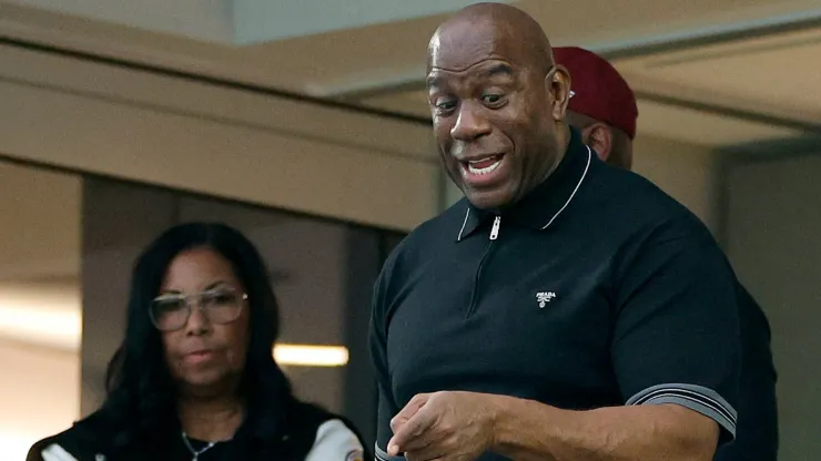 Minority Owner Magic Johnson of the Washington Commanders with wife Cookie Johnson react during the game against the Los Angeles Rams at SoFi Stadium on December 17, 2023 in Inglewood, California.
