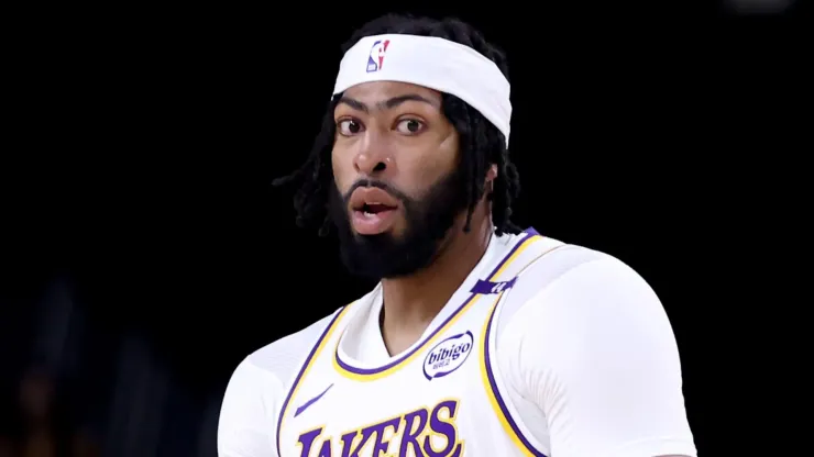 Anthony Davis #3 of the Los Angeles Lakers reacts after a three-point basket during the first quarter against the Phoenix Suns at Acrisure Arena on October 06, 2024 in Palm Springs, California.
