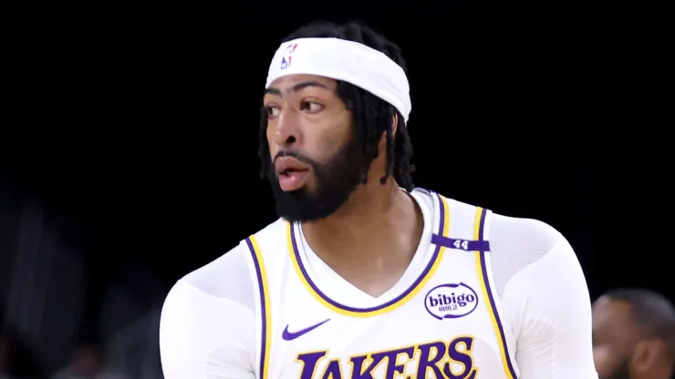 Anthony Davis #3 of the Los Angeles Lakers reacts after a three-point basket during the first quarter against the Phoenix Suns at Acrisure Arena on October 06, 2024 in Palm Springs, California.
