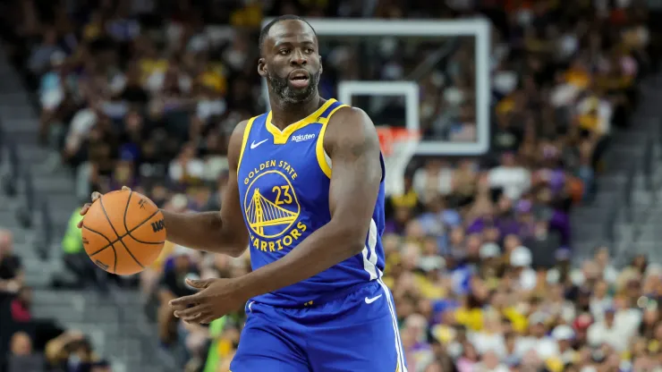 Draymond Green #23 of the Golden State Warriors brings the ball up the court against the Los Angeles Lakers in the second quarter of their preseason game
