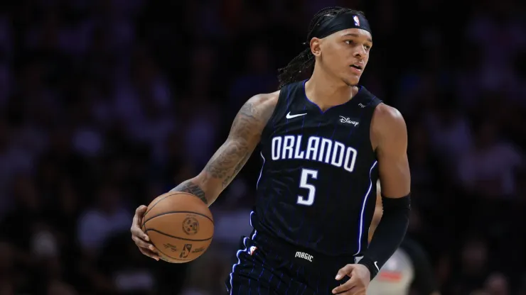 Paolo Banchero #5 of the Orlando Magic controls the ball against the Miami Heat during the second half at Kaseya Center on October 23, 2024 in Miami, Florida.
