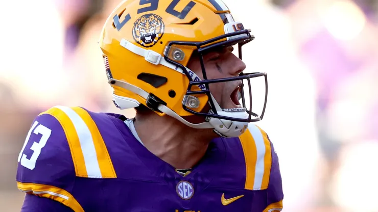 Garrett Nussmeier #13 of the LSU Tigers reacts after throwing a touchdown pass during the fourth quarter of an NCAA football game against the UCLA Bruins at Tiger Stadium on September 21, 2024 in Baton Rouge, Louisiana.
