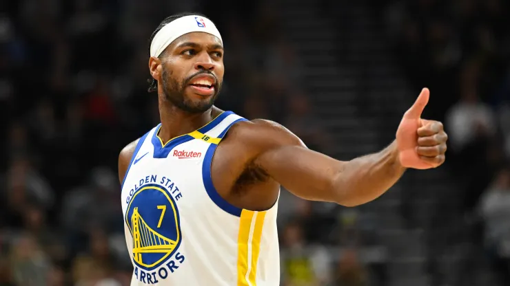 Buddy Hield #7 of the Golden State Warriors motions to a teammate during the second half of a game against the Utah Jazz
