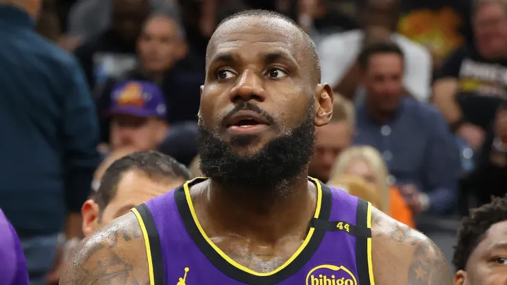 Bronny James #9 and LeBron James #23 of the Los Angeles Lakers sit on the bench during the second half of the NBA game against the Phoenix Suns at Footprint Center on October 28, 2024 in Phoenix, Arizona. The Suns defeated the Lakers 109-105.

