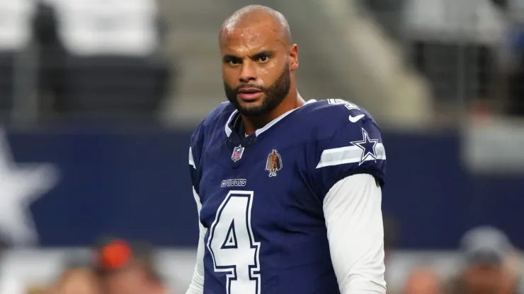 Dak Prescott #4 of the Dallas Cowboys looks on while warming up before a game against the Detroit Lions at AT&T Stadium on October 13, 2024.
