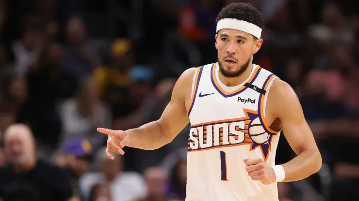 Devin Booker #1 of the Phoenix Suns reacts after scoring against the Los Angeles Lakers
