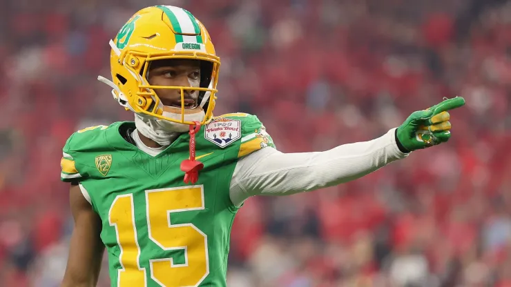 Wide receiver Tez Johnson #15 of the Oregon Ducks reacts to a first down against the Liberty Flames during the first half of the Fiesta Bowl at State Farm Stadium on January 01, 2024 in Glendale, Arizona.
