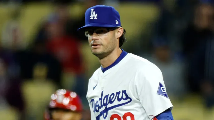 Relief pitcher Joe Kelly #99 of the Los Angeles Dodgers reacts to third base umpire after a balk call to score Matt Carpenter #13 of the St. Louis Cardinals from third base with the bases loaded during the seventh inning at Dodger Stadium on March 30, 2024 in Los Angeles, California.
