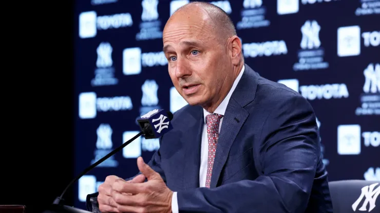 New York Yankees General Manager Brian Cashman speaks to the media prior to the start of the game against the Boston Red Sox at Yankee Stadium. 
