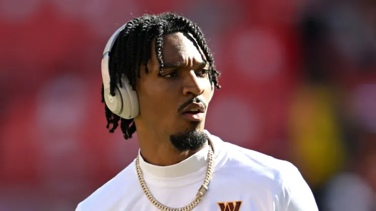 Jayden Daniels #5 of the Washington Commanders warms up prior to the game against the Carolina Panthers at FedExField on October 20, 2024 in Landover, Maryland.
