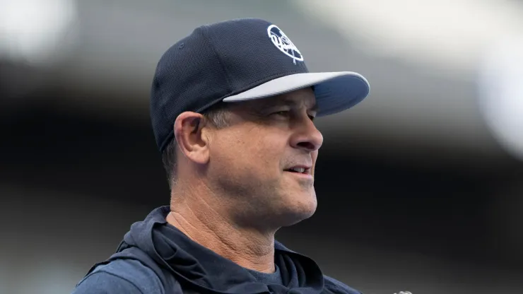 Manager Aaron Boone #17 of the New York Yankees plays catch before a game against the Chicago White Sox at Guaranteed Rate Field on August 12, 2024 in Chicago, Illinois.
