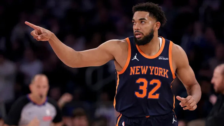 Karl-Anthony Towns #32 of the New York Knicks celebrates his three point shot in the first half against the Milwaukee Bucks at Madison Square Garden
