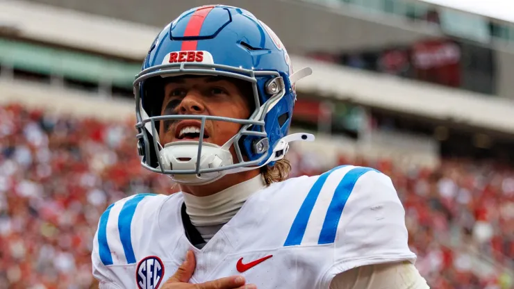 Jaxson Dart #2 of the Ole Miss Rebels celebrates after throwing a touchdown pass in the second half during a game against the Arkansas Razorbacks at Donald W. Reynolds Razorback Stadium on November 02, 2024 in Fayetteville, Arkansas. The Rebels defeated the Razorbacks 63-31.
