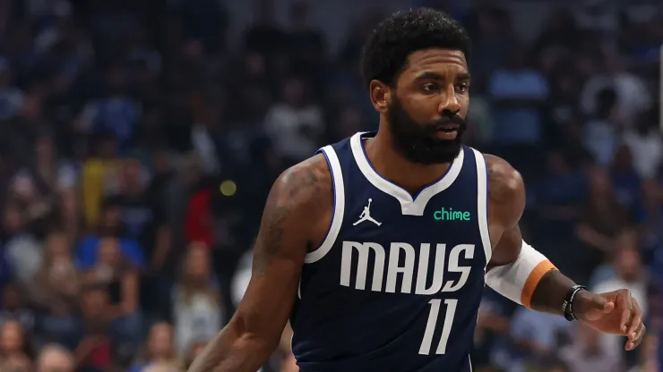 Kyrie Irving #11 of the Dallas Mavericks drives against the San Antonio Spurs during the first quarter of the game at American Airlines Center
