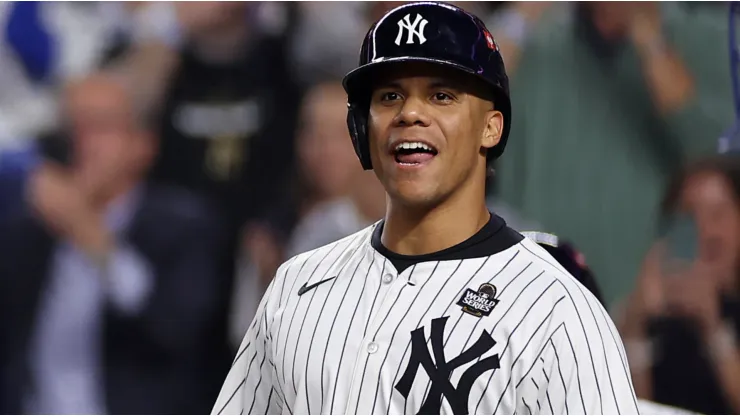 Juan Soto #22 of the New York Yankees waits to congratulate Aaron Judge #99 after Judge hit a two-run home run during the first inning of Game Five of the 2024 World Series against the Los Angeles Dodgers at Yankee Stadium on October 30, 2024 in the Bronx borough of New York City.
