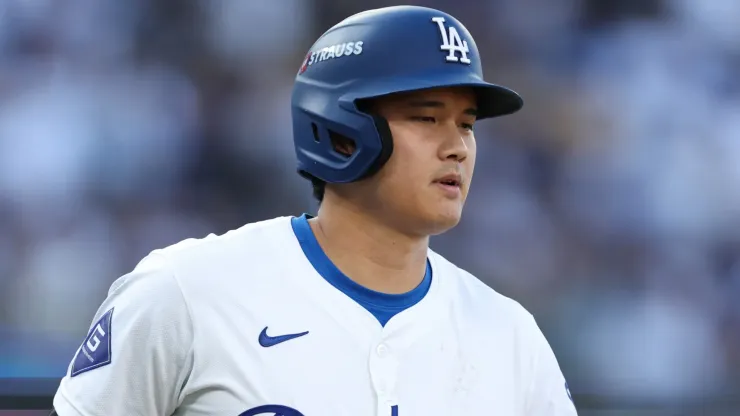 Shohei Ohtani #17 of the Los Angeles Dodgers walks to the first base during the ninth inning of Game Two of the Championship Series against the New York Mets at Dodger Stadium on October 14, 2024 in Los Angeles, California. 
