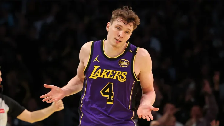 Dalton Knecht #4 of the Los Angeles Lakers reacts after scoring his fourth consecutive 3-point basket against the Utah Jazz during the third quarter of the Emirates NBA Cup at Crypto.com Arena on November 19, 2024 in Los Angeles, California.
