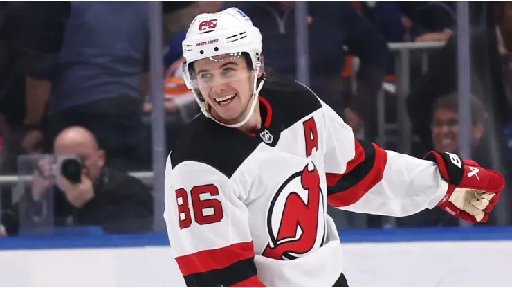 Jack Hughes #86 of the New Jersey Devils celebrates after scoring the winning overtime goal against the New York Islanders during their game at UBS Arena on November 09, 2024 in Elmont, New York. 
