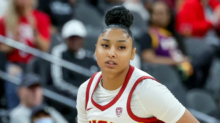 JuJu Watkins #12 of the USC Trojans brings the ball up the court against the Ohio State Buckeyes in the second half of their game during the Naismith Basketball Hall of Fame Series
