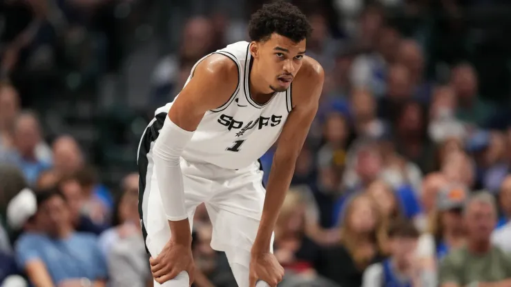 Victor Wembanyama #1 of the San Antonio Spurs looks on as they play the Dallas Mavericks at American Airlines Center on October 24, 2024 in Dallas, Texas. The Dallas Mavericks won 120-109.
