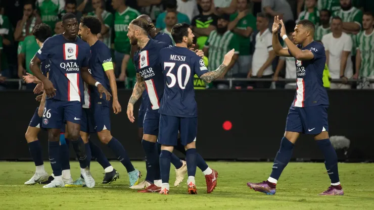 HAIFA, ISRAEL - SEPTEMBER 14: Kylian Mbappé of Paris Saint-Germain celebrates with Lionel Messi after socirng his team's third goal during the UEFA Champions League group H match between Maccabi Haifa FC and Paris Saint-Germain at Sammy Ofer Stadium on September 14, 2022 in Haifa, Israel.  (Photo by Amir Levy/Getty Images)
