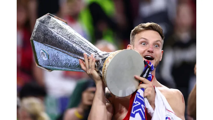 BUDAPEST, HUNGARY - MAY 31: Ivan Rakitic of Sevilla FC holds the winners trophy after the UEFA Europa League 2022/23 final match between Sevilla FC and AS Roma at Puskas Arena on May 31, 2023 in Budapest, Hungary. (Photo by Clive Rose/Getty Images)
