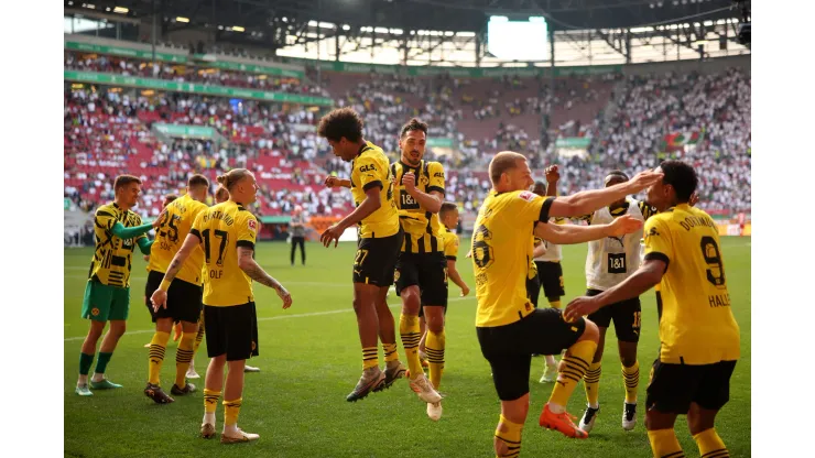 AUGSBURG, GERMANY - MAY 21: Karim Adeyemi and Mats Hummels of Borussia Dortmund celebrate after the team's victory in the Bundesliga match between FC Augsburg and Borussia Dortmund at WWK-Arena on May 21, 2023 in Augsburg, Germany. (Photo by Adam Pretty/Getty Images)
