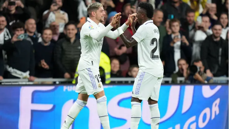 MADRID, SPAIN - OCTOBER 22: Federico Valverde celebrates with Vinicius Junior of Real Madrid after scoring their team's third goal during the LaLiga Santander match between Real Madrid CF and Sevilla FC at Estadio Santiago Bernabeu on October 22, 2022 in Madrid, Spain. (Photo by Angel Martinez/Getty Images)
