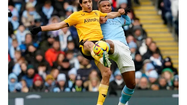 Manchester, England, 22nd January 2023. Raul Jimenez of Wolverhampton Wanderers tussles with Manuel Akanji of Manchester
