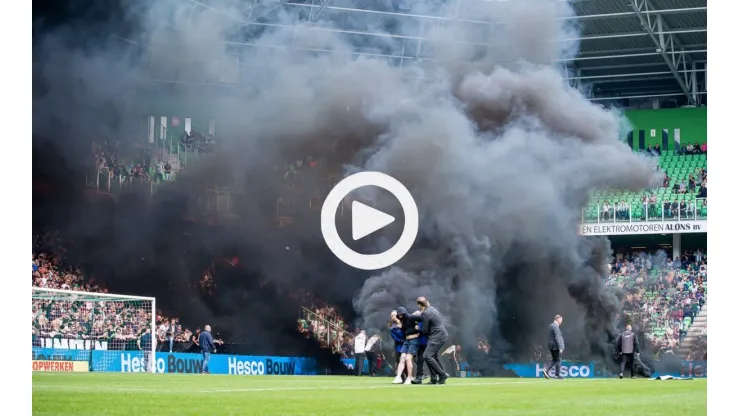 GRONINGEN - Supporter storms the field during the Dutch premier league match between FC Groningen and Ajax at the Eurobo
